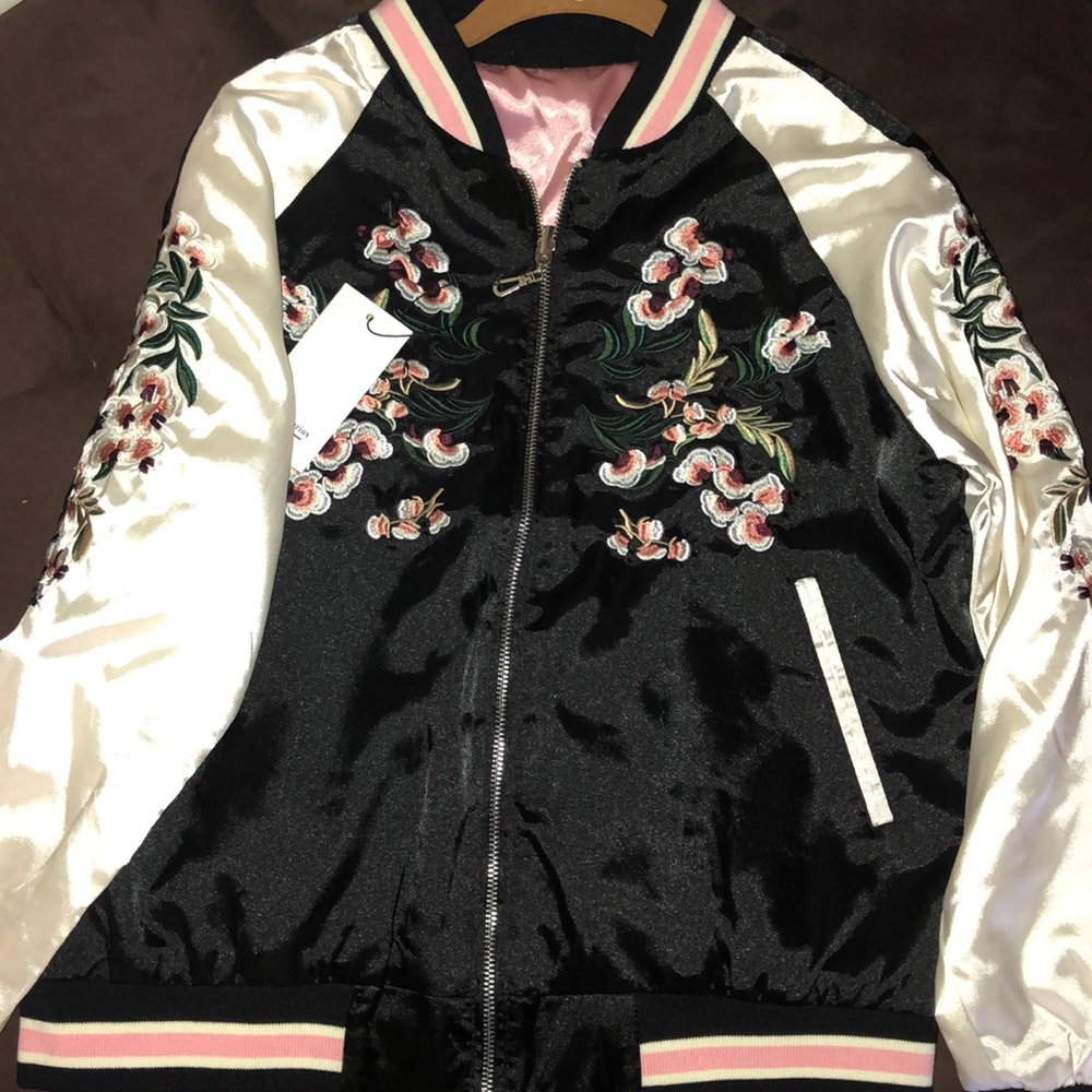 A embroidered reversible floral bomber jacket